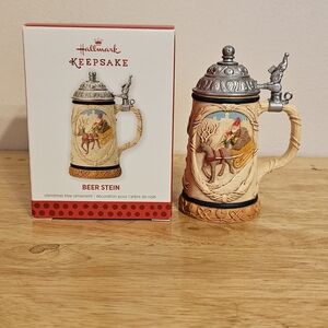 The 2013 Hallmark Keepsake Ornament Beer Stein featuring Santa Claus in a sleigh